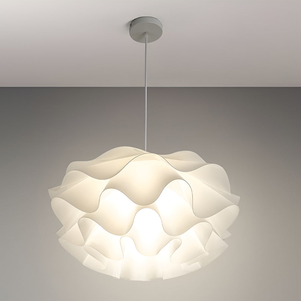 Lotus flower pendant light illuminating a white ceiling with soft glow.