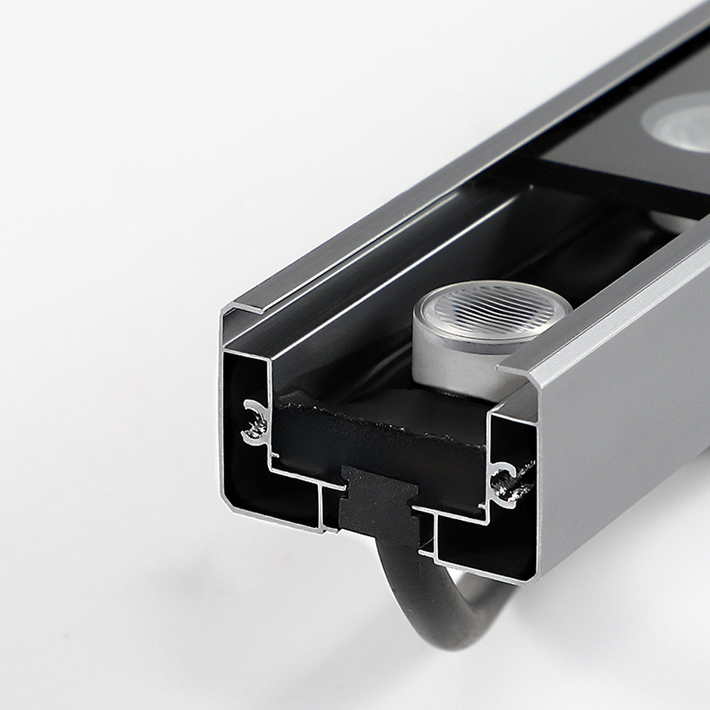 Low voltage wall wash light with a black aluminum housing, displayed from an angle to show its sturdy build.