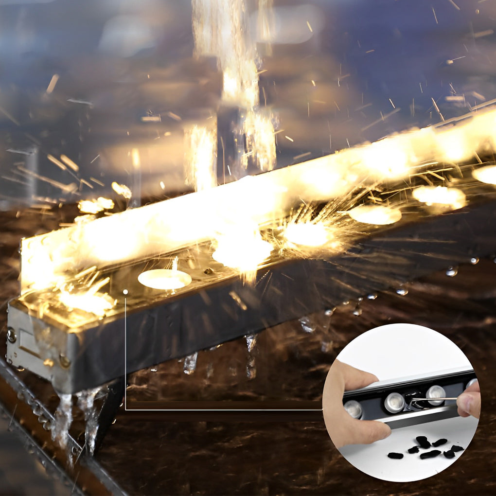 Low voltage wall wash light in action, showing bright illumination along the edge of a building at night.