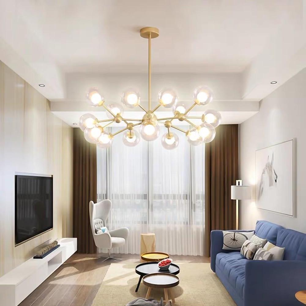 Luxury living room featuring a gold glass sputnik light with multiple clear globe shades.