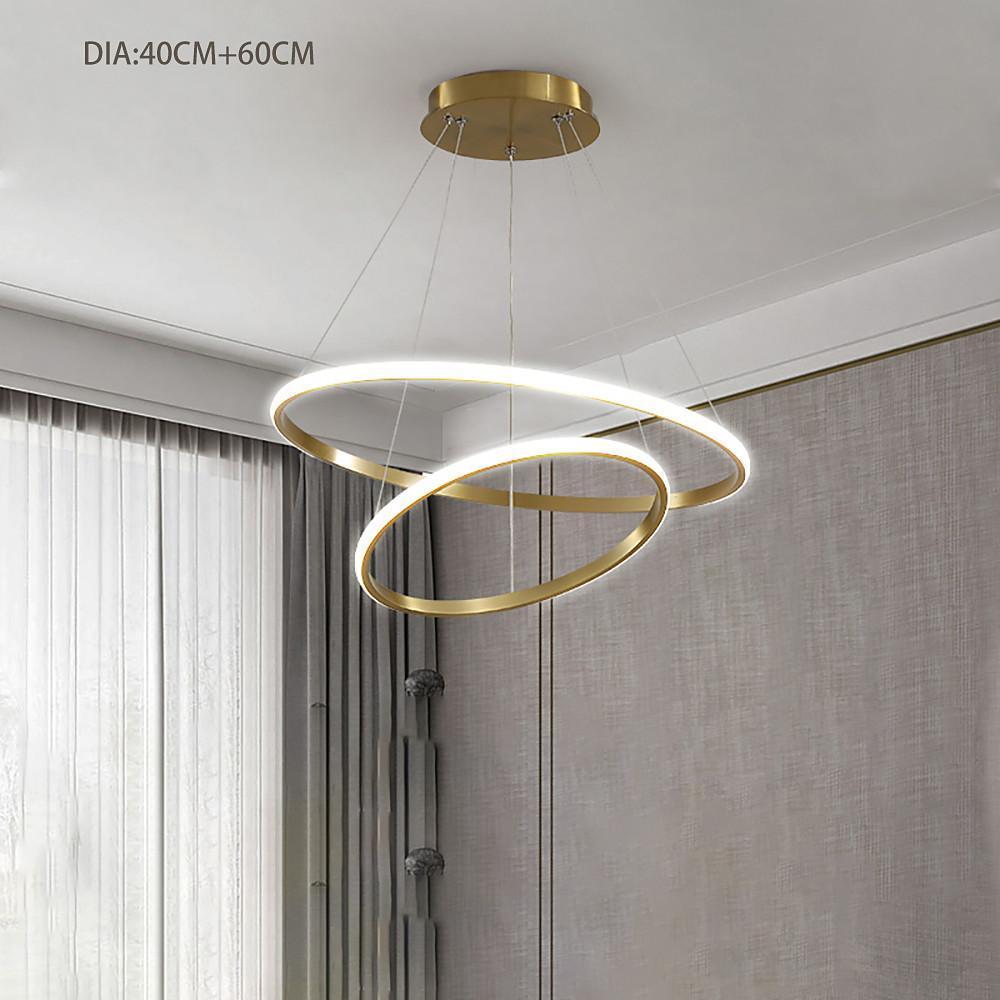 Gold ring LED chandelier in luxury interior setting.