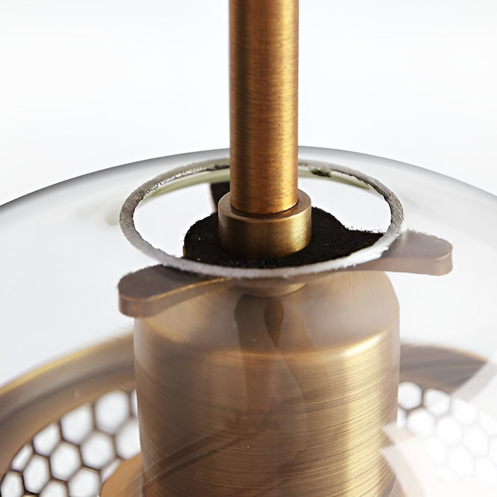 Macro detail of Clear Glass Globe Pendant showing the brushed brass hardware and glass rim.