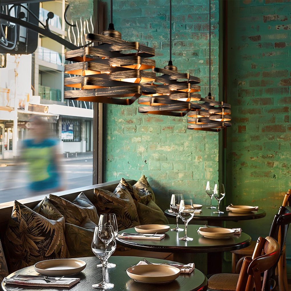 Metal ribbon pendant lights hanging in modern industrial dining space.