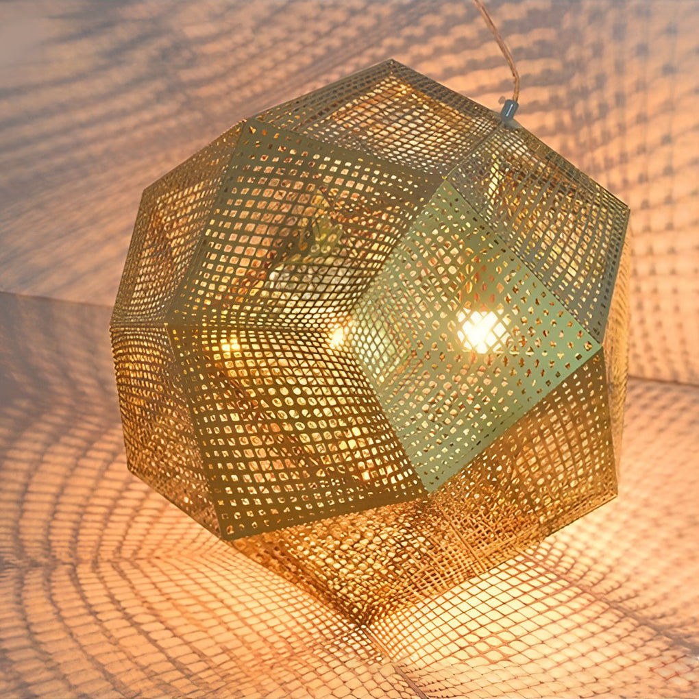 Metal shade pendant light with perforated panels casting patterned shadows on surrounding surfaces.