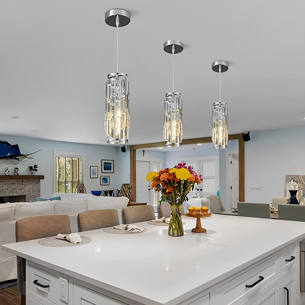 Mini crystal pendant lights illuminating a large open-plan kitchen and living space.