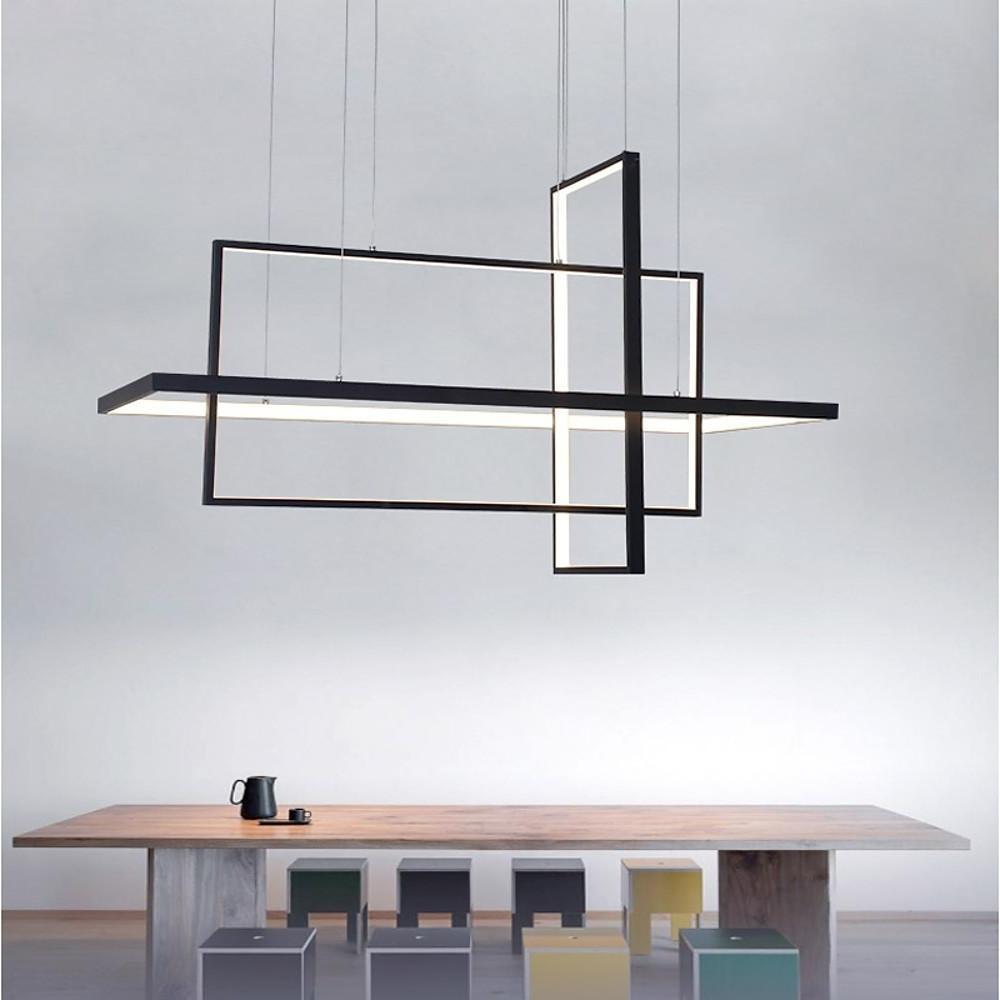 Minimalist dining room chandelier with black linear geometric frame suspended above modern dining table.