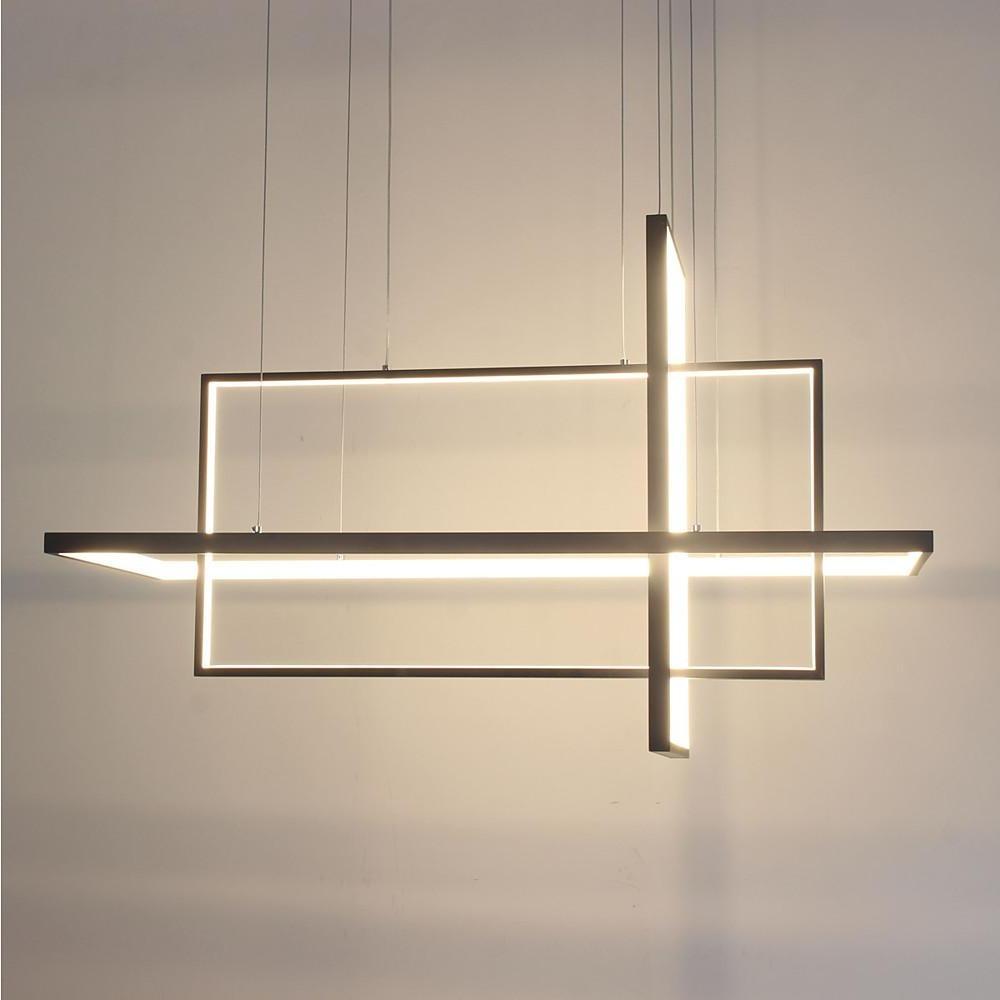 Minimalist dining room chandelier illuminated in warm light showing modern linear structure.
