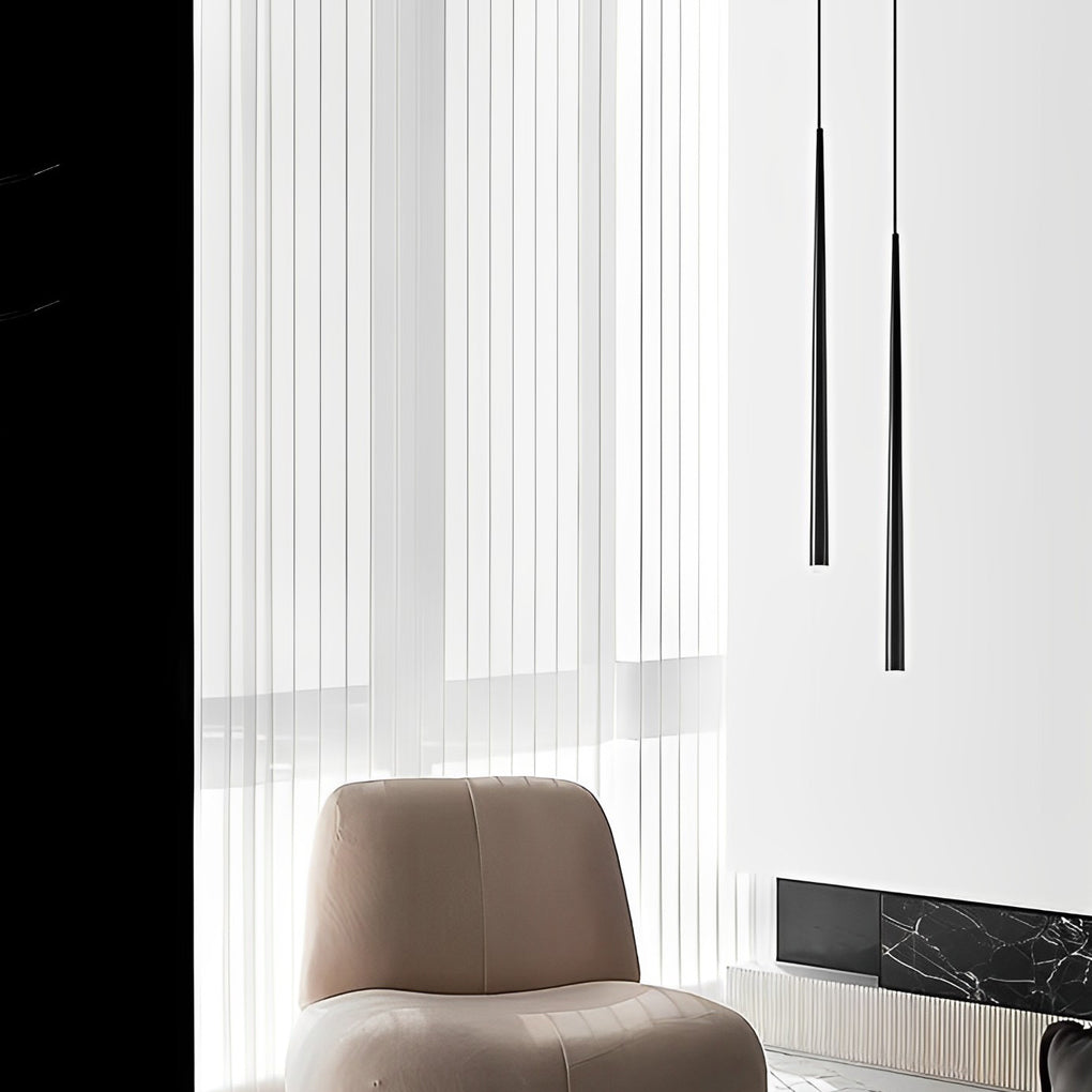 Minimalist Slim Black Pendant Light set hanging in a bright living room corner near windows.
