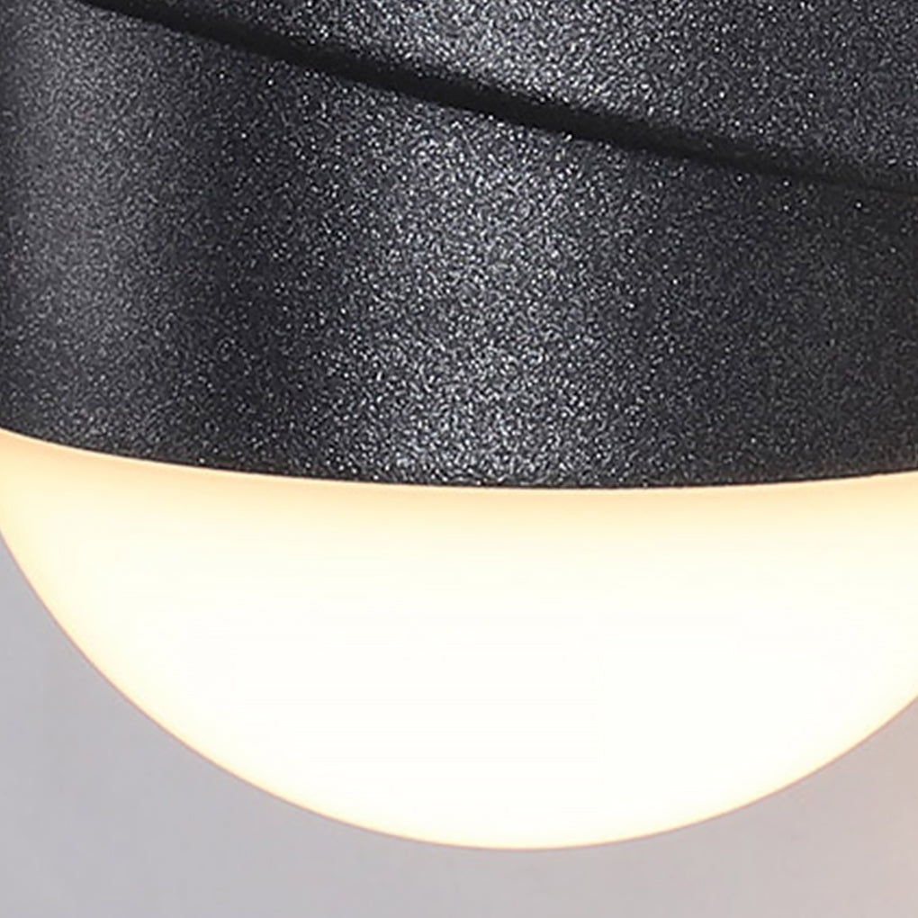 Modern double heads wall sconce with close-up of its oval light and black finish.