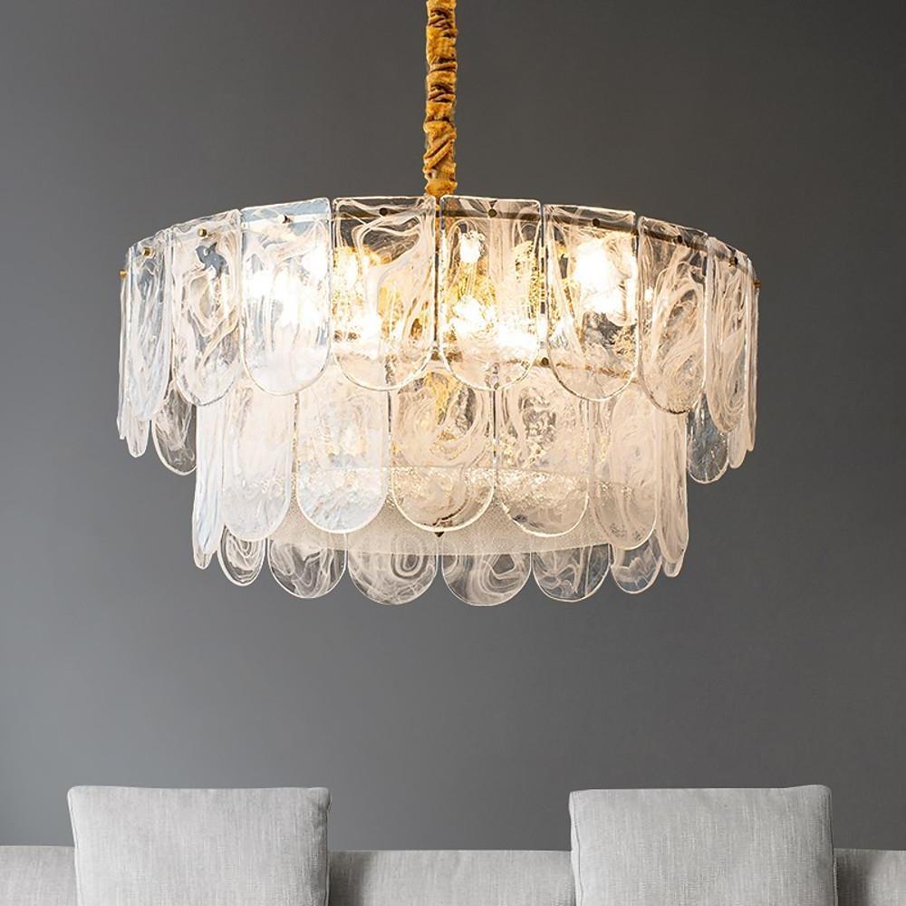 Modern glass drum chandelier with layered frosted and clear scalloped panels and a warm glow.
