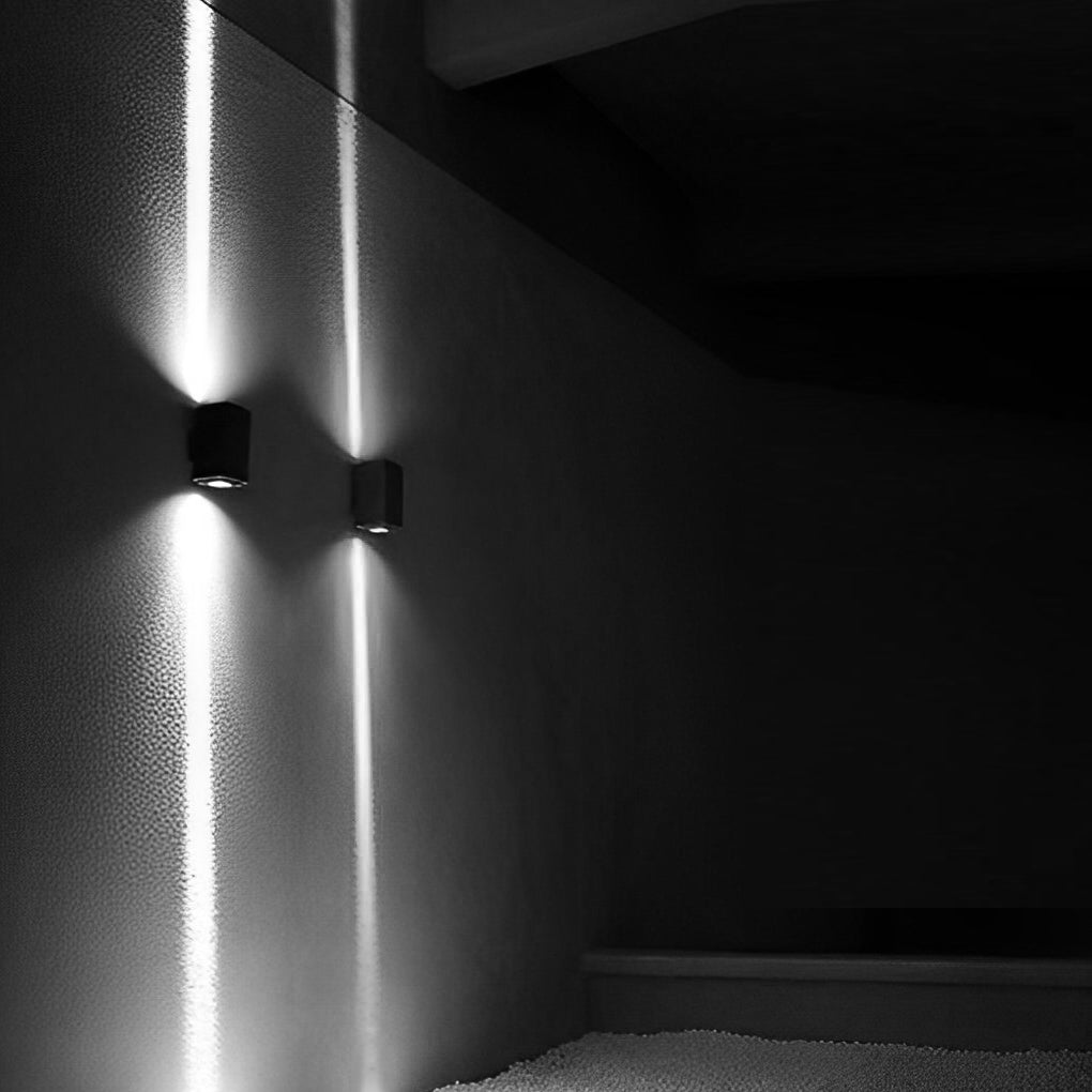 Modern narrow beam wall sconce detail showing rectangular housing and focused light aperture.