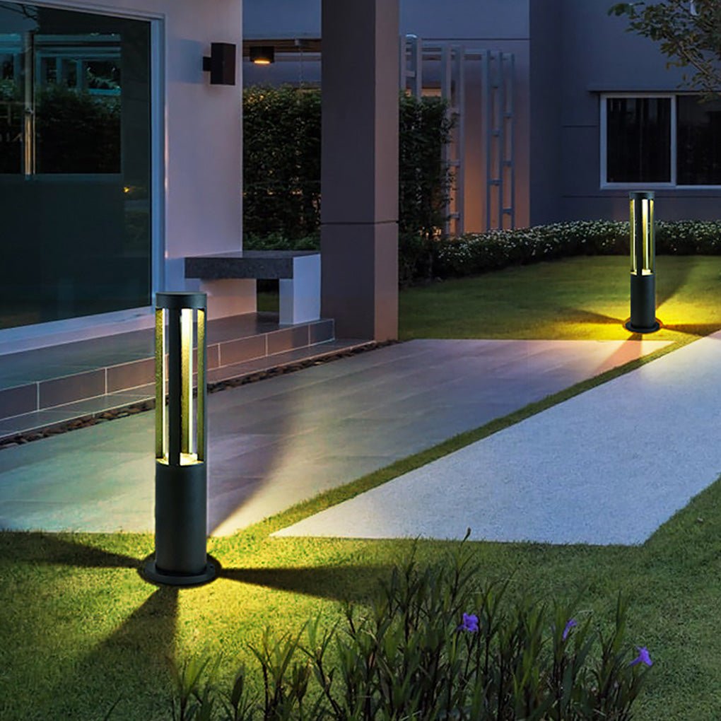 Modern outdoor bollard lights providing subtle light on a modern outdoor staircase.