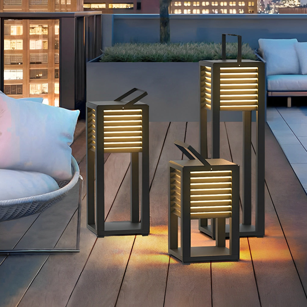 Modern outdoor floor lantern set illuminating a balcony lounge area at night.