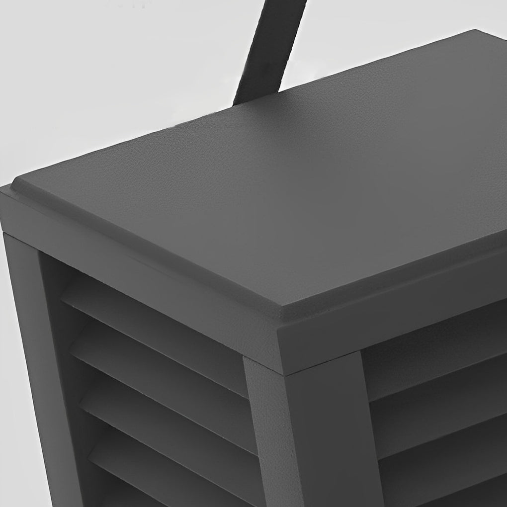 Modern outdoor floor lantern top handle and slatted shade detail view.