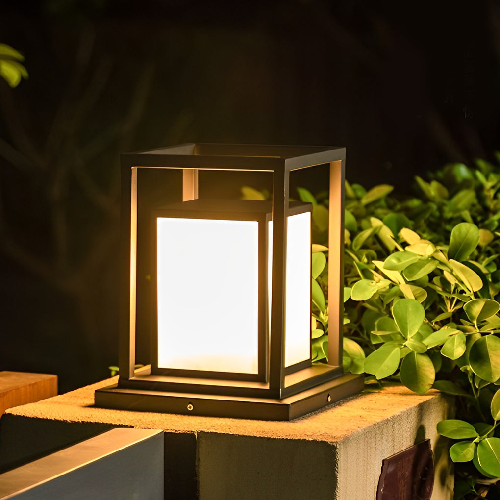 Modern outdoor wall pillar light glowing softly on balcony edge surrounded by greenery.