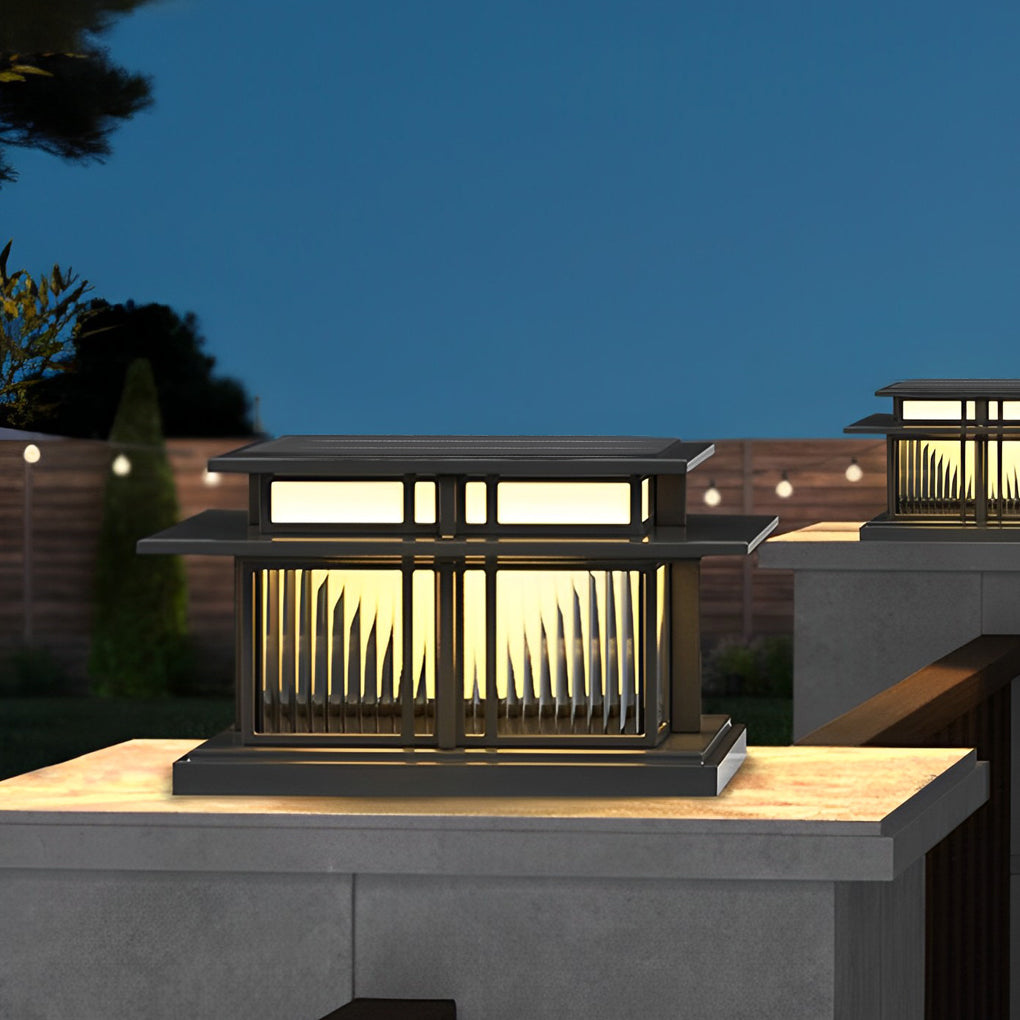 Modern porch pillar light with horizontal slat design placed on a concrete column at dusk.