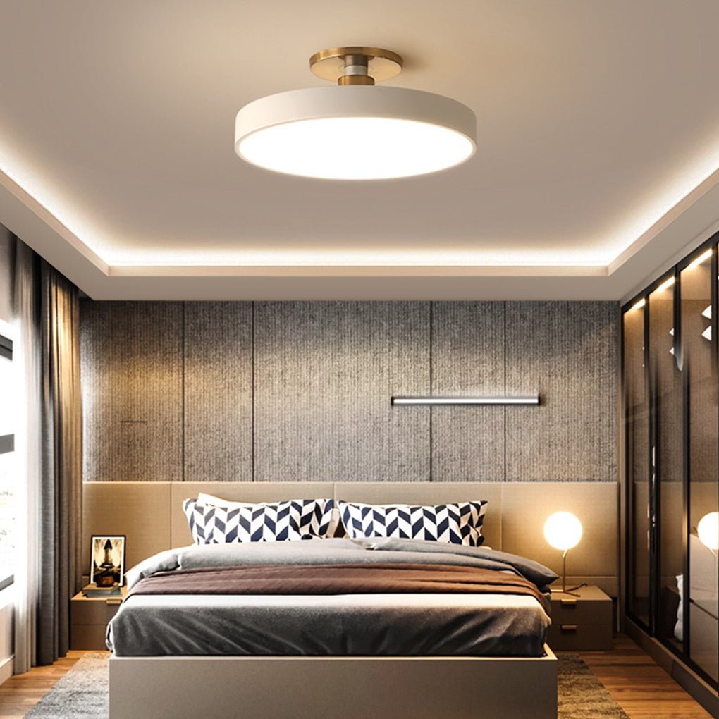 Modern semi flush mount ceiling lights enhancing a stylish bedroom with sleek, minimalist design.