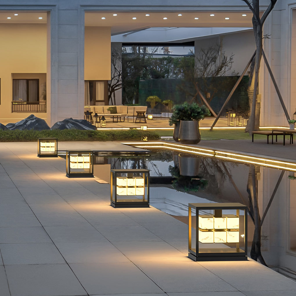 Modern solar brick pillar lights in landscape pathway