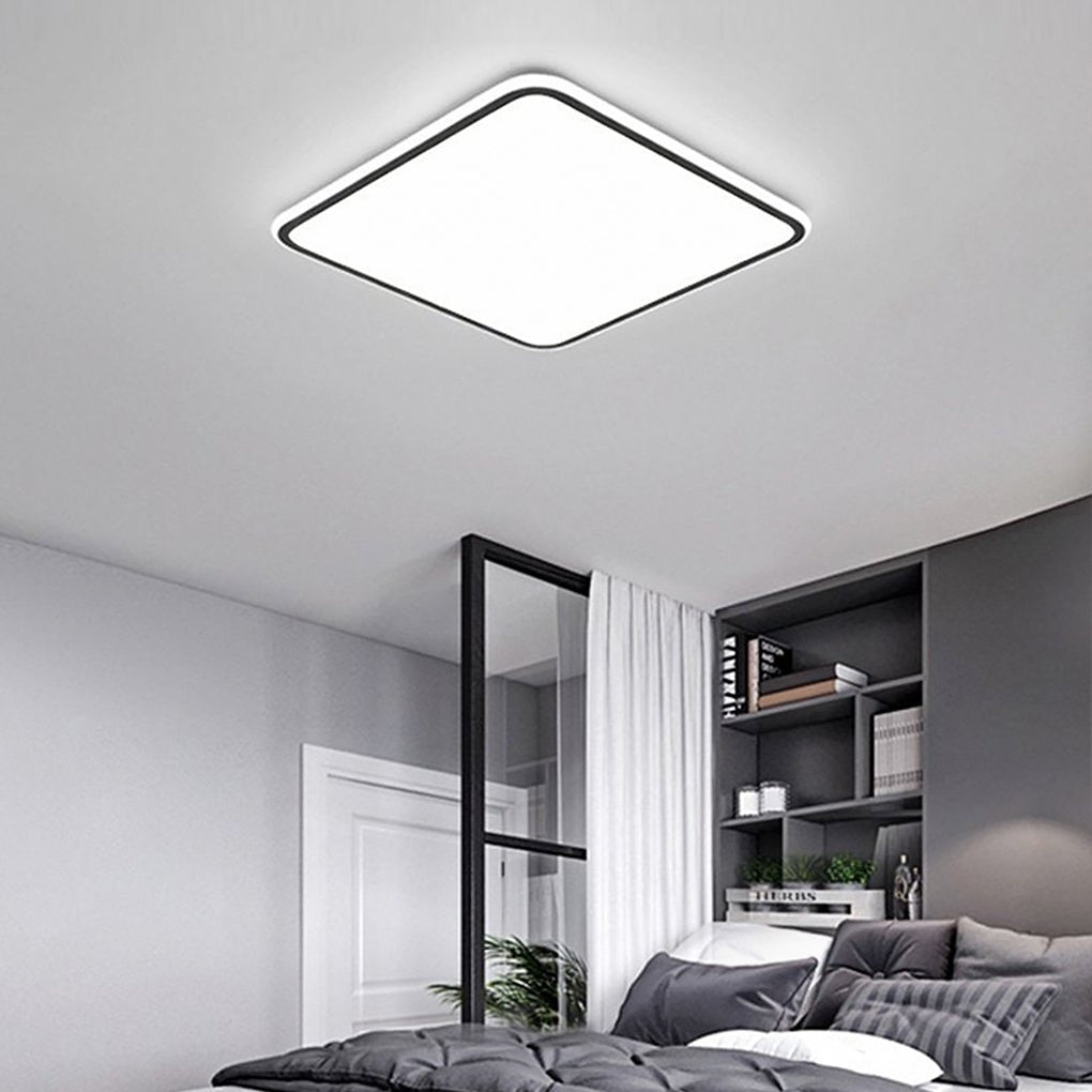 Modern square LED ceiling light with a minimalist design, mounted on a white ceiling.