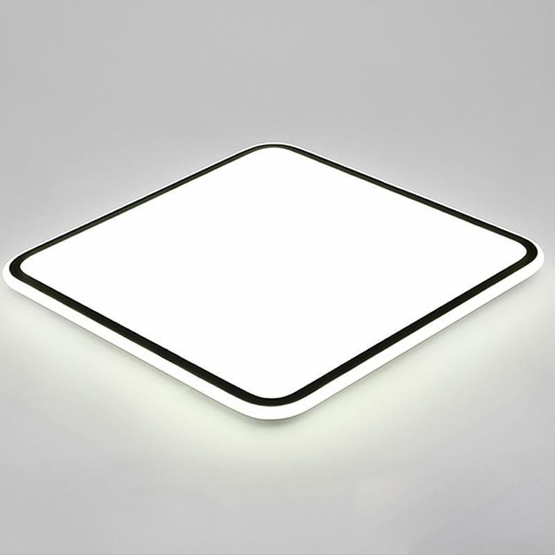 Modern square LED ceiling light with a sleek design, illuminating a contemporary room.