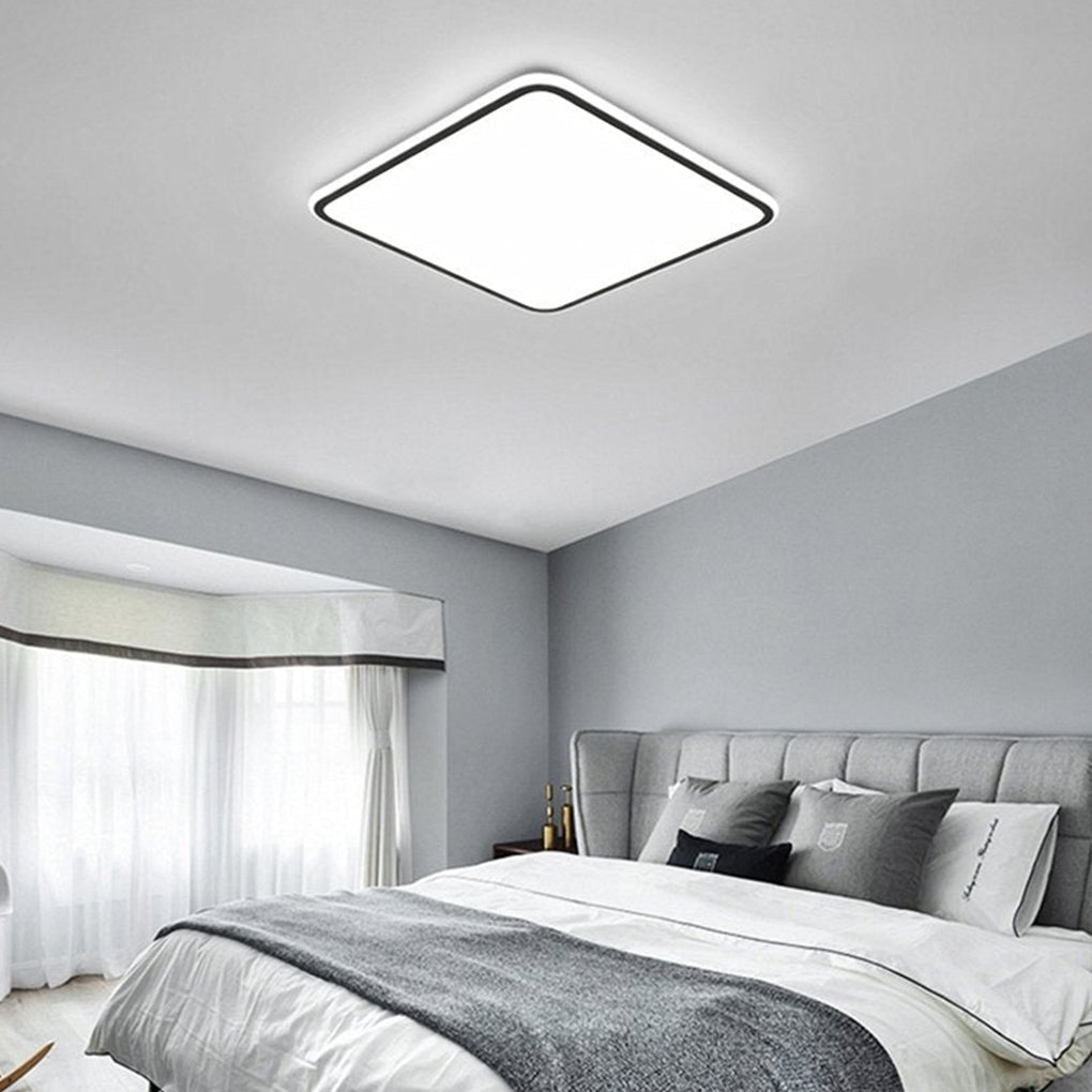 Modern square LED ceiling light with a sleek design, providing soft illumination.