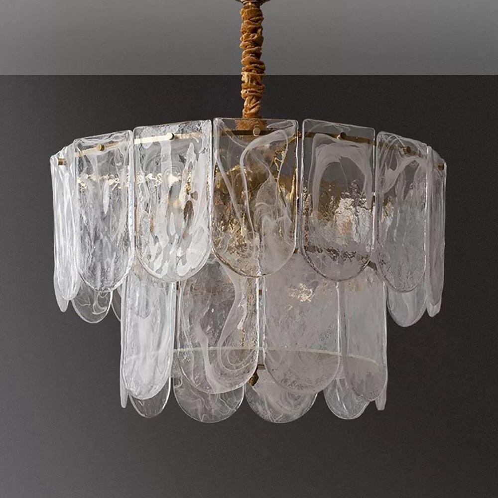 Modern glass drum chandelier featuring multiple layers of clear glass rods and a bright gold frame.