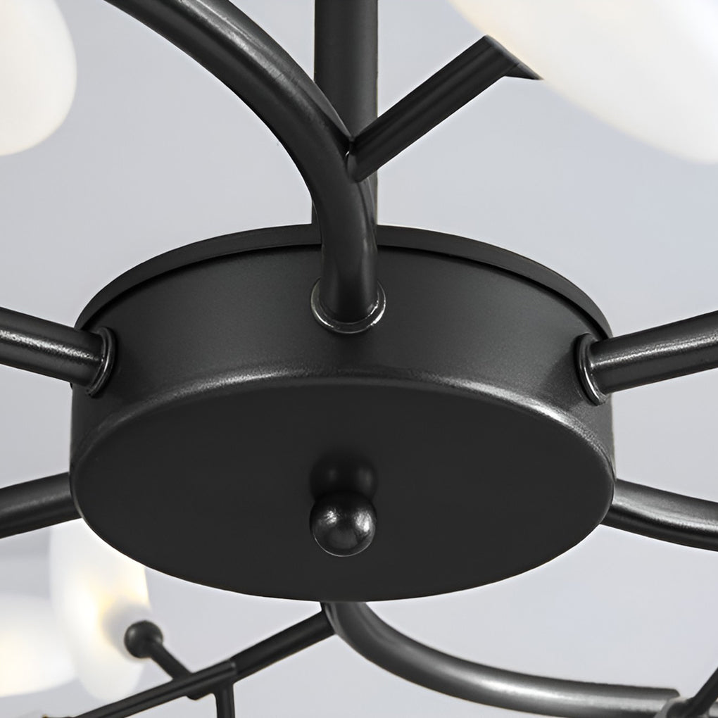 Modern tree branch chandelier with a close-up of the light bulbs and branches.