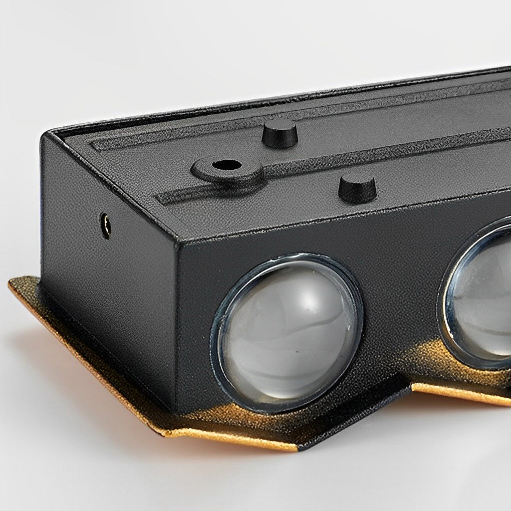 Modern up and down wall lights on a brick exterior wall, producing dramatic layered light effects for architectural emphasis.