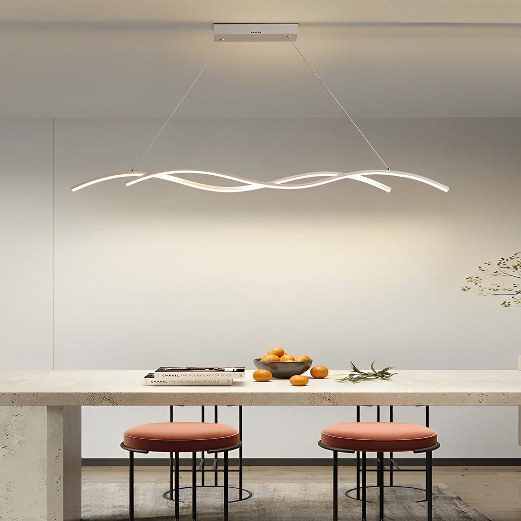 Modern wave LED pendant light showcased above a long kitchen island with clean modern styling.
