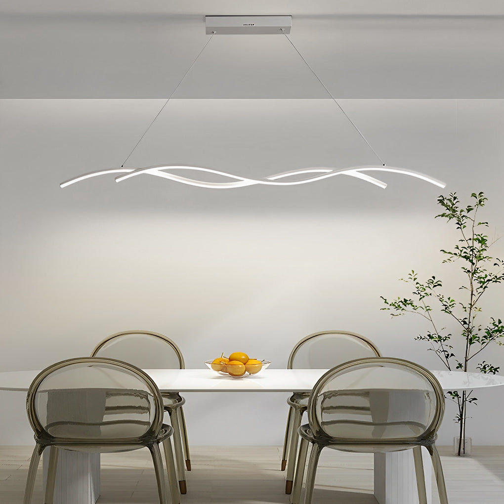 Modern wave LED pendant light hanging above a sleek dining area with neutral tones and modern furniture.