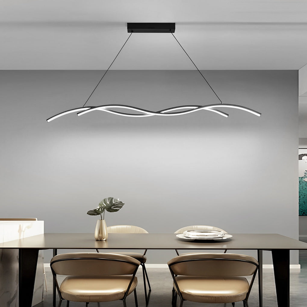 Modern wave LED pendant light suspended over a rectangular dining table in a refined modern home.