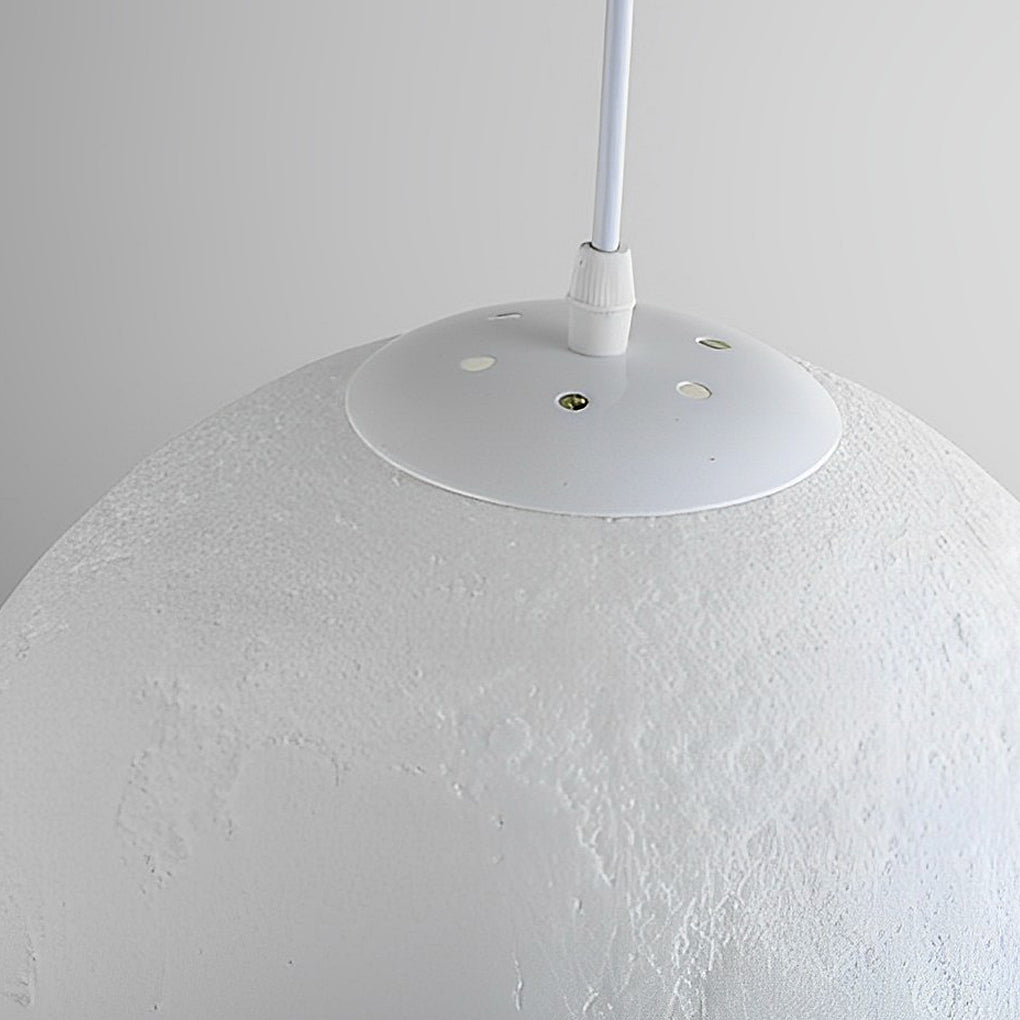 Close-up of moon globe light surface showing detailed lunar texture.