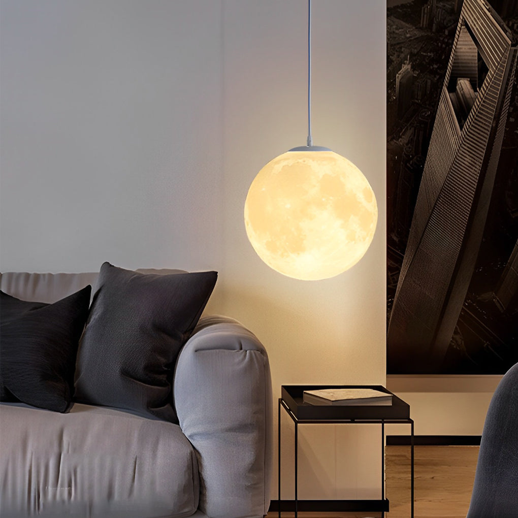 Moon globe pendant light above sofa creating soft ambient lighting.