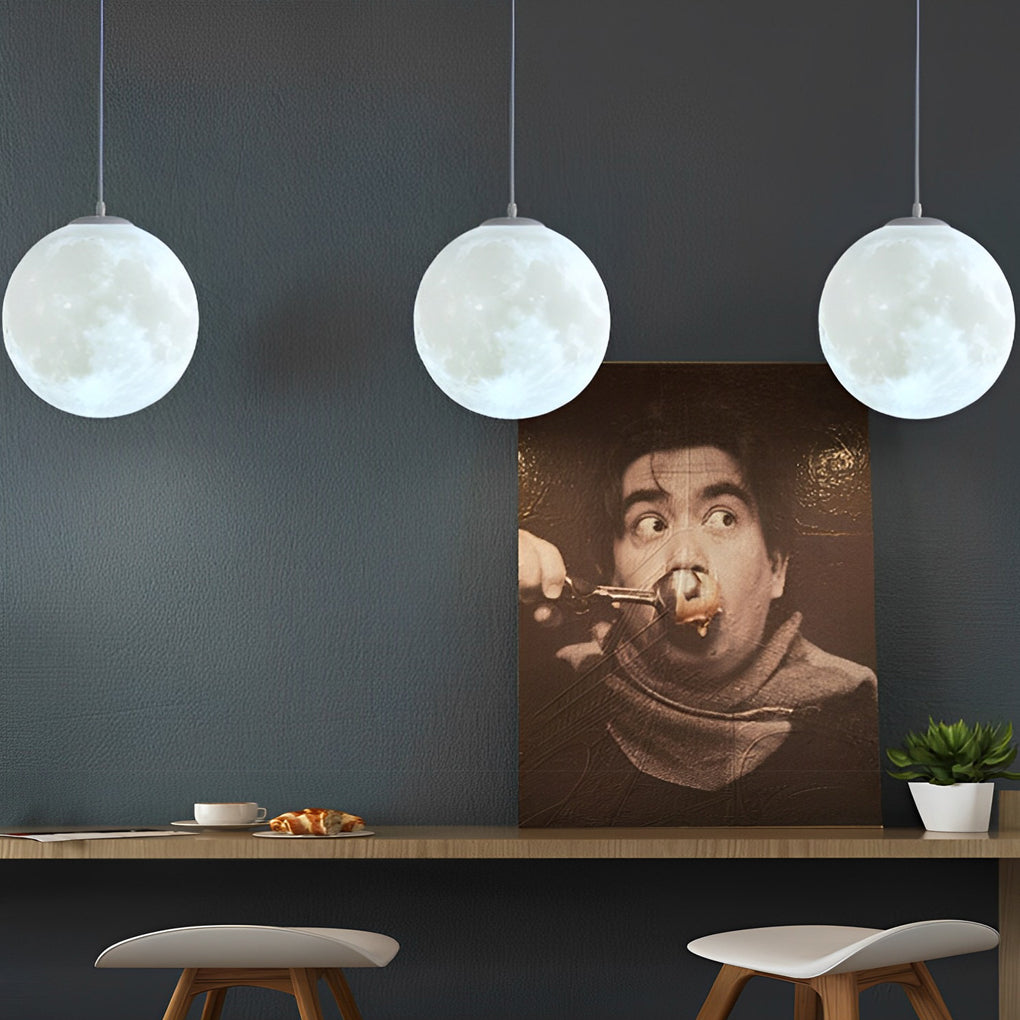 Multiple moon globe pendant lights aligned in a row for interior lighting design.