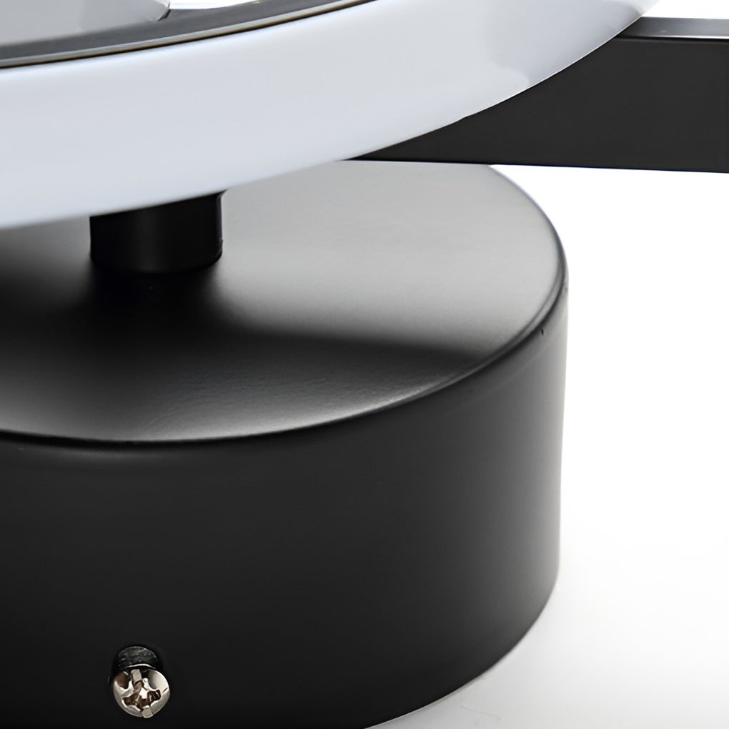 Musical note wall light with a close-up of the curved treble clef shape.