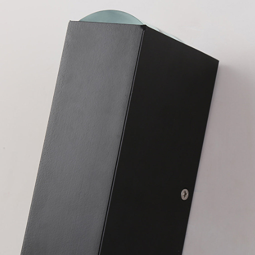 Angled view of a matte black narrow beam wall sconce, showcasing its slim rectangular profile and modern finish.