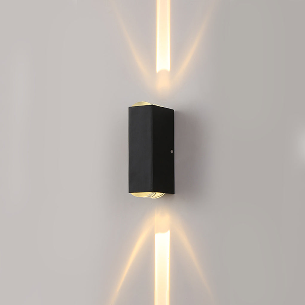 Single narrow beam wall sconce on a light-colored wall, projecting clean up and down light with a minimalist look.