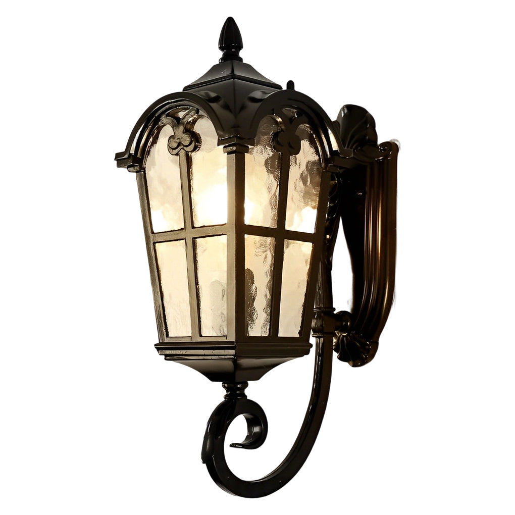 Outdoor black sconce with frosted glass, casting a soft glow on an exterior wall.