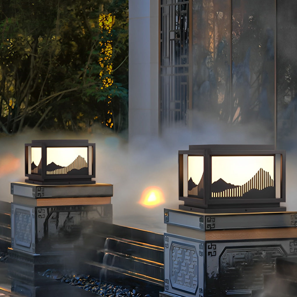 Outdoor brick pillar lights providing soft illumination along a stylish driveway.