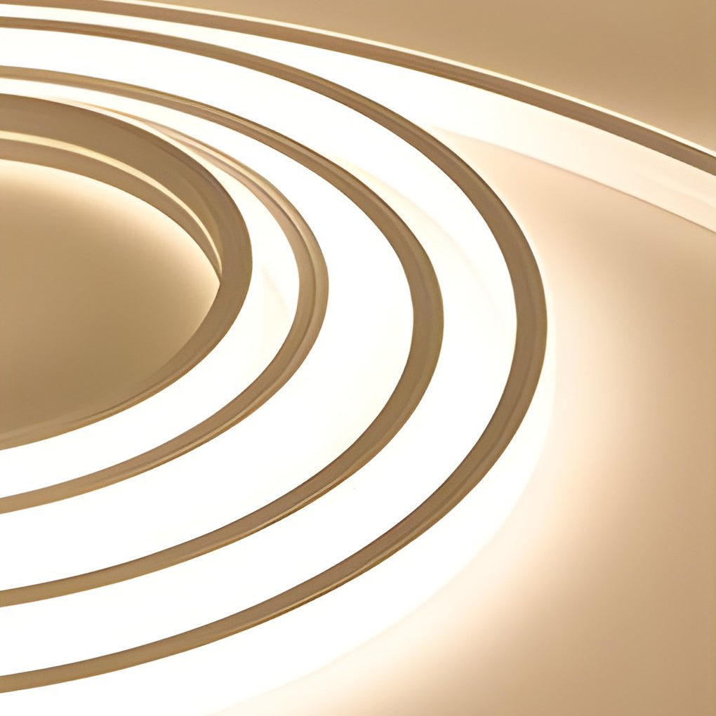 Outdoor embedded LED light strips enhancing curved architectural details with modern lighting.