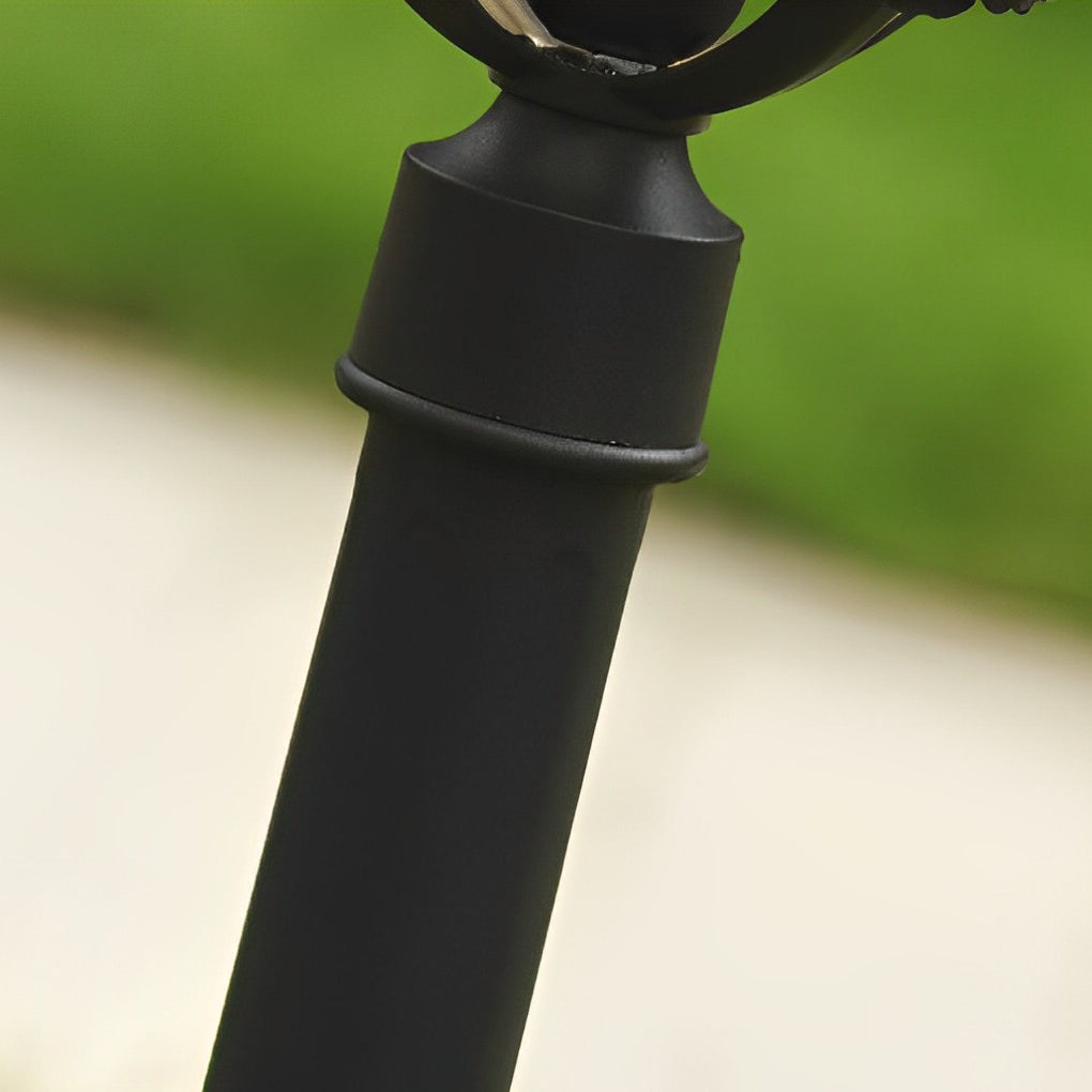 Outdoor lawn lights with a classic design, providing warm light in a garden.