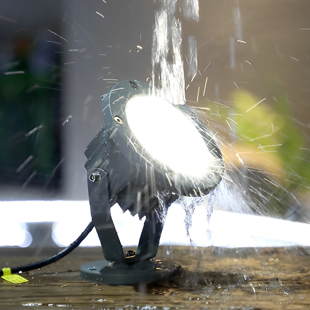 Outdoor LED spotlights energy efficient landscape lighting highlights trees, shrubs, and architectural features with modern style.