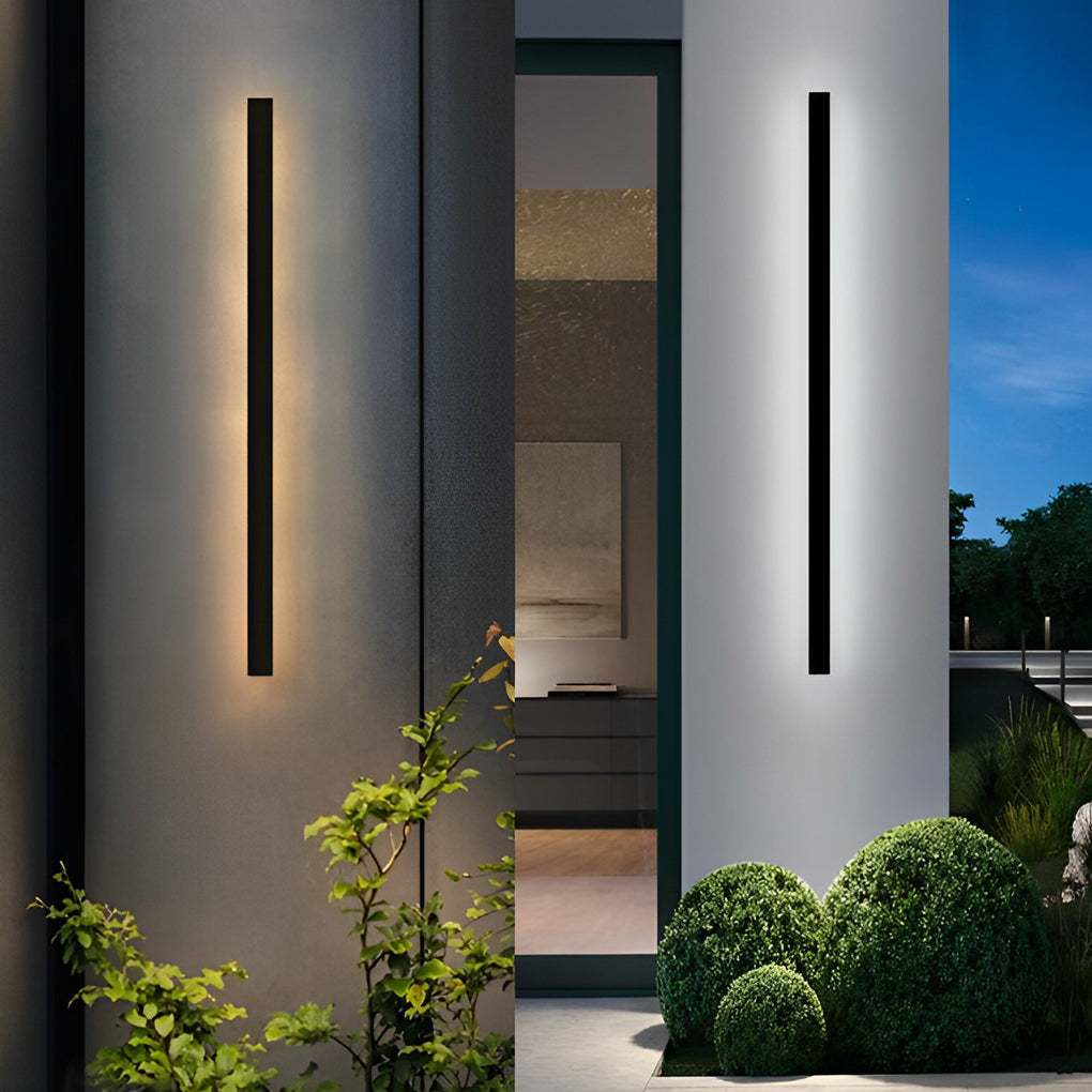 Minimalist Long Linear LED Waterproof Black Modern SolaOutdoor linear wall light mounted on curved exterior wall highlighting contemporary architectural lines.r Wall Sconce Lighting | Dazuma