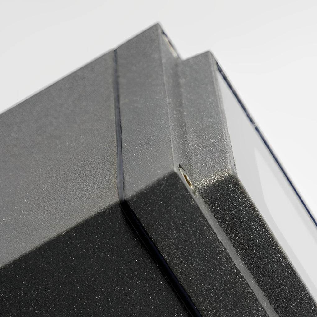 Outdoor narrow beam wall sconce installed on corner wall to accent architectural lines.