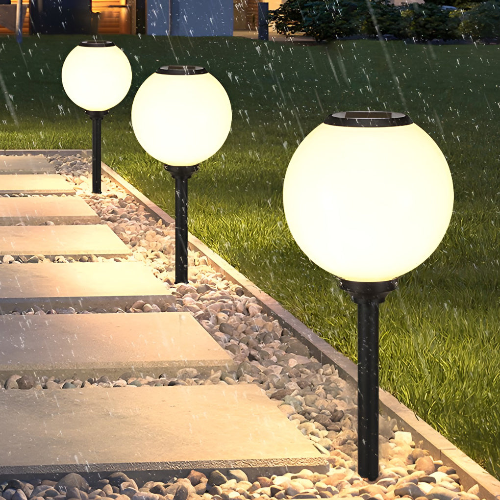 Outdoor path light globe with detailed view of its solar panel and structure.