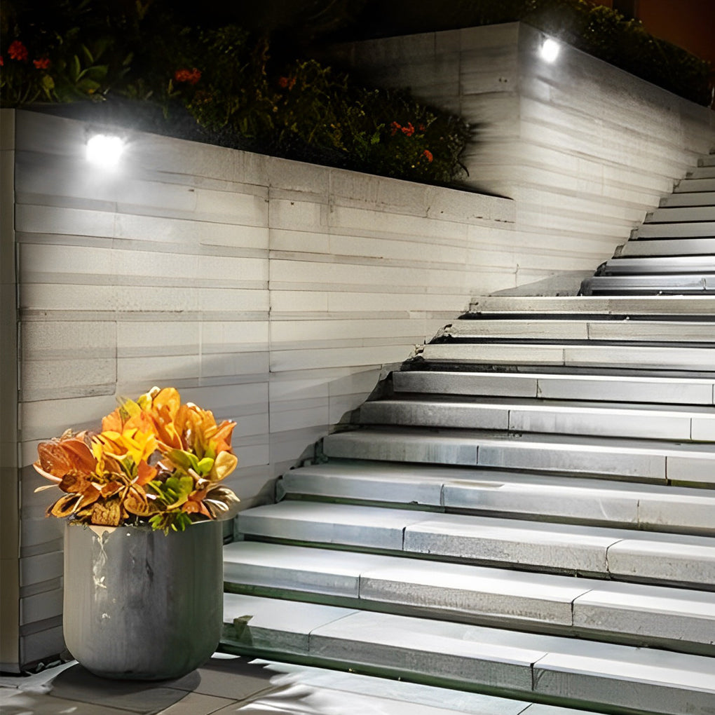 Outdoor solar wall light with motion sensor displayed on a white background, showcasing modern design.