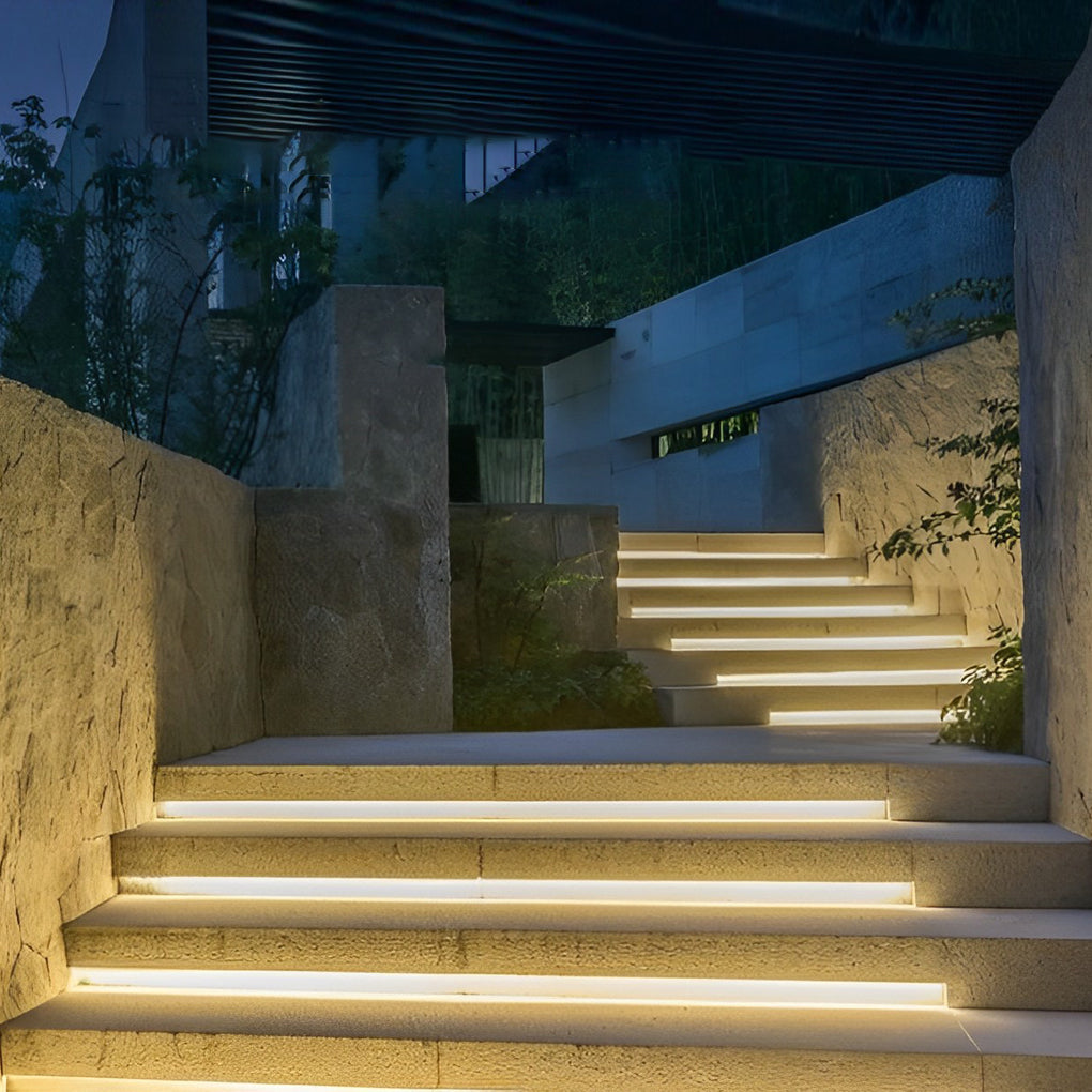 Outdoor stair lighting strips illuminating curved garden steps with elegant light.