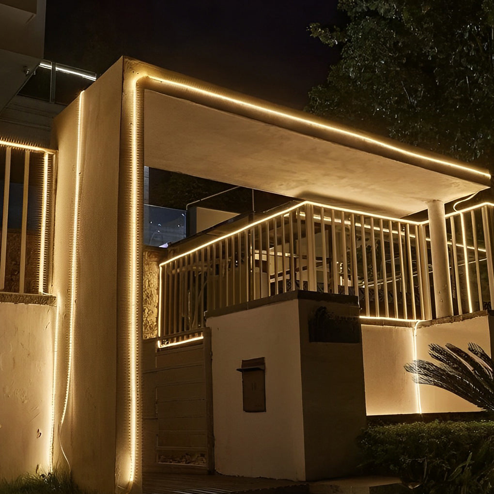 Outdoor stair lighting strips illuminating a curved staircase with modern design.