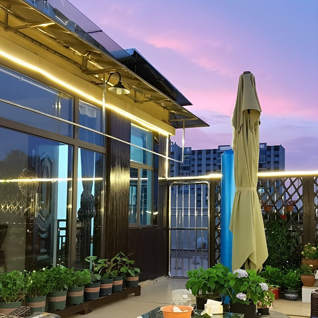 Side-emitting outdoor stair lighting strips on a rooftop garden staircase
