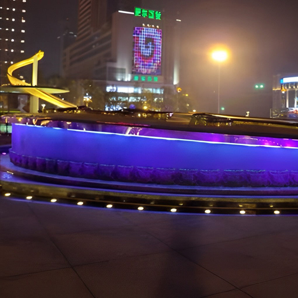 Colorful outdoor step light fixtures installed in a curved staircase, adding a playful touch.